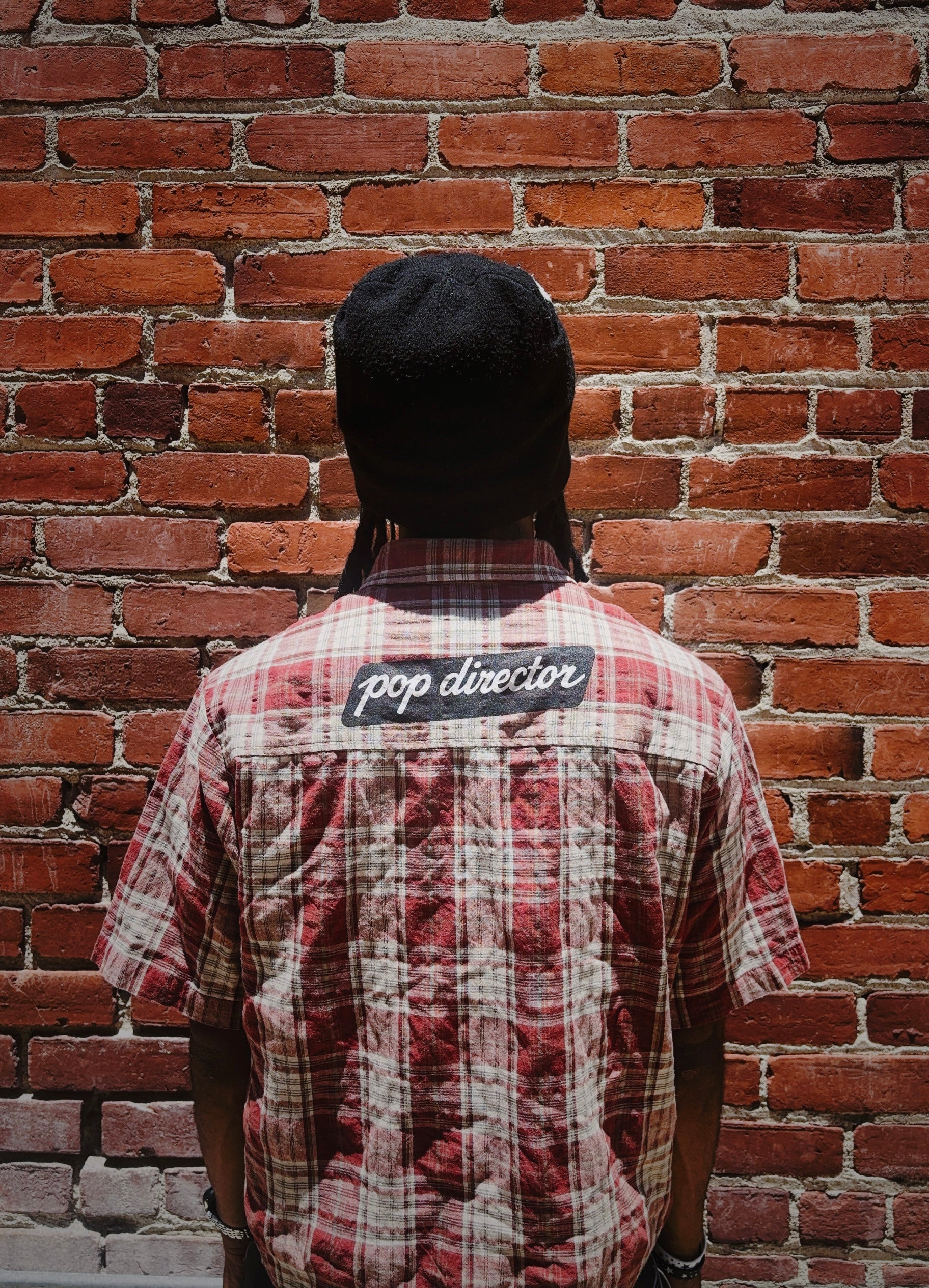 pop director plaid shirt
