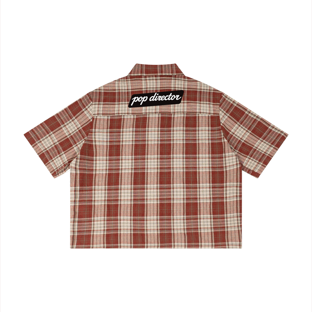 pop director plaid shirt